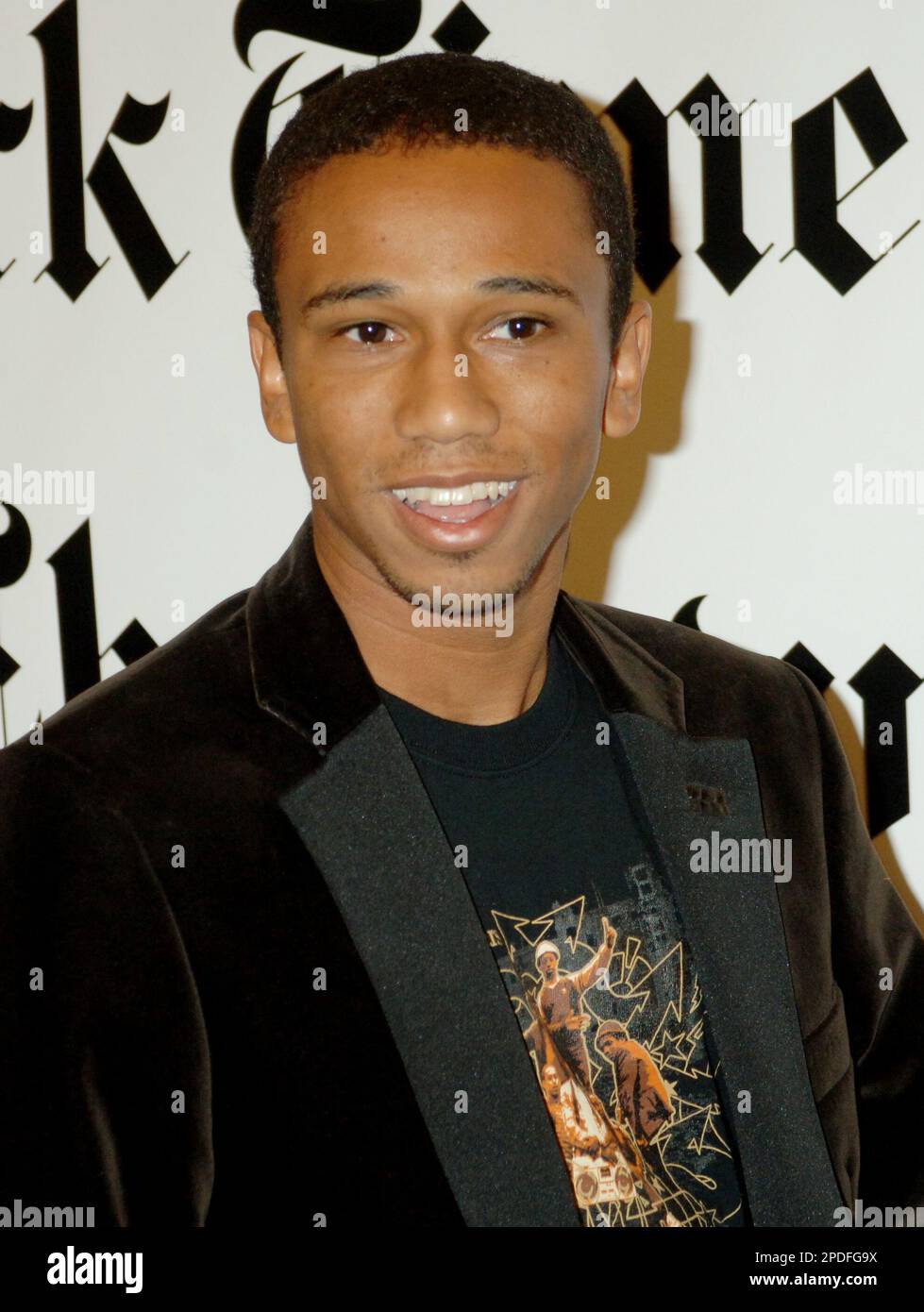 Aaron McGruder, creator of "The Boondocks," poses for photos before