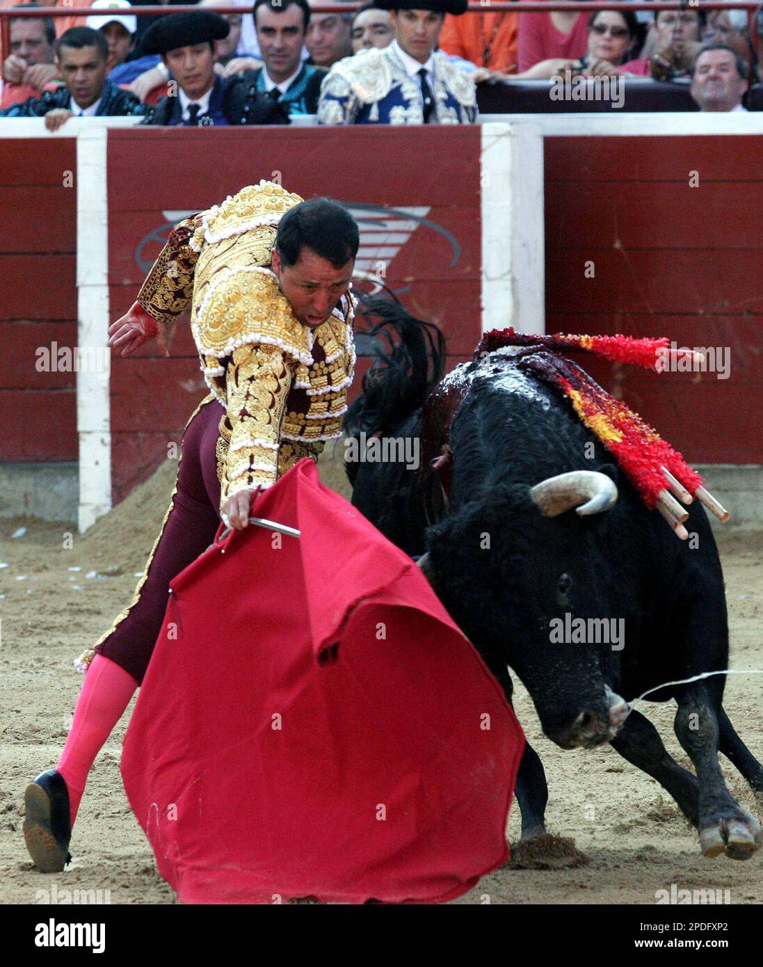 Colombia's bullfighter Cesar Ricon performs a pass during a bullfight ...