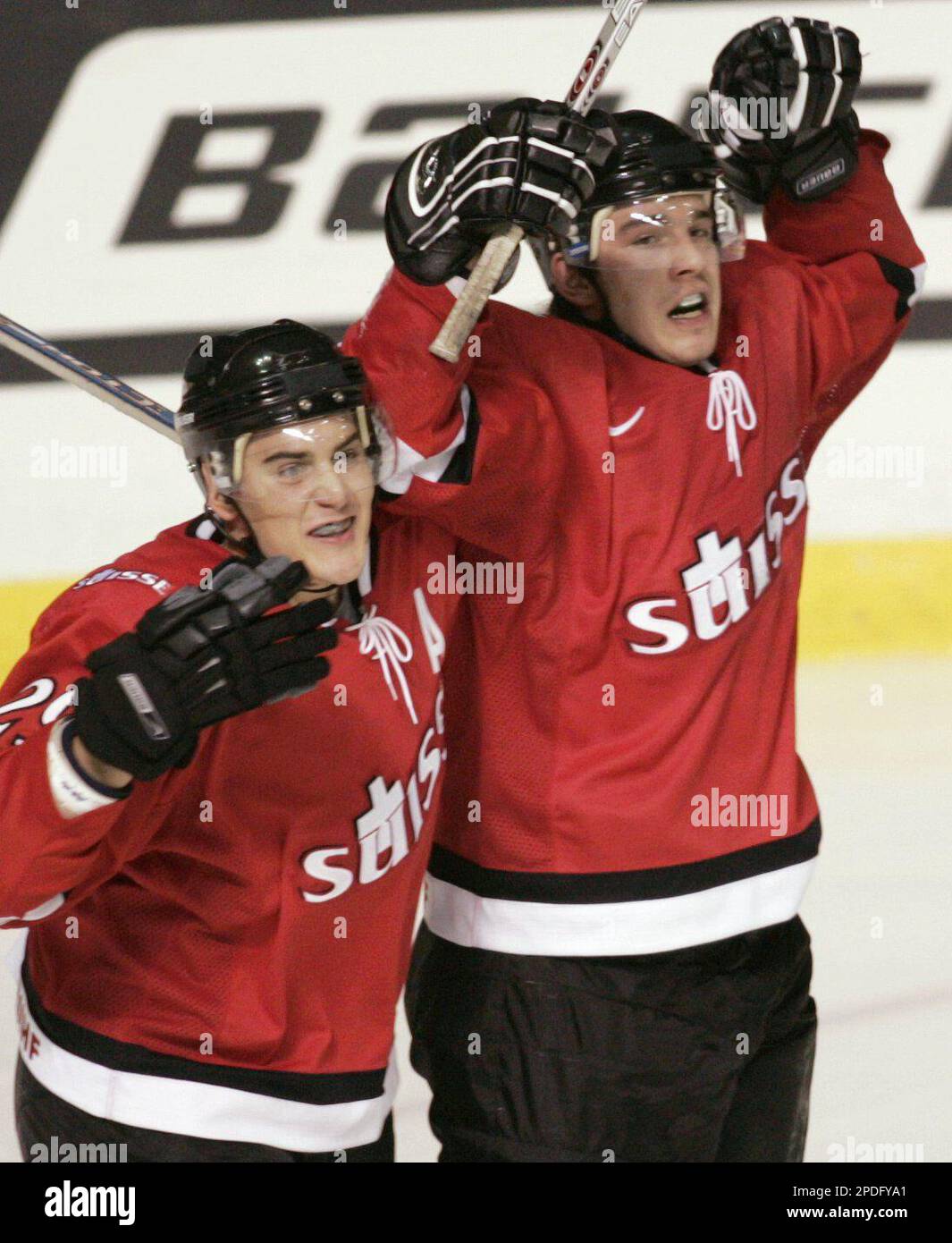 Team Switzerland's Julian Walker (left) congratulates Mathias Joggi