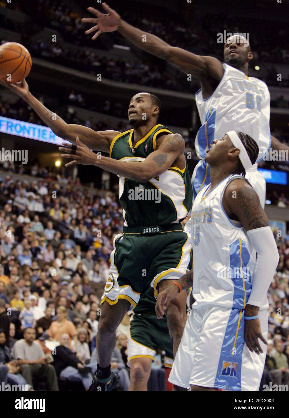 Seattle SuperSonics forward Rashard Lewis, left, goes up for a shot ...