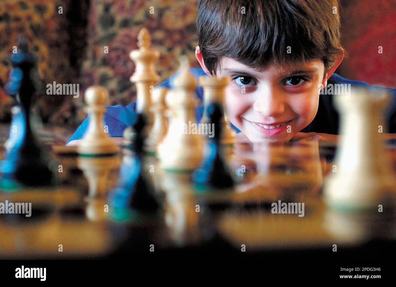 Six-year-old Ian Gilchrist is seen Dec. 21, 2005 behind a chess board at  his home in Marion, Ill. Gilchrist won a scholastic chess tournament  earlier this month, sponsored by the U.S. Chess