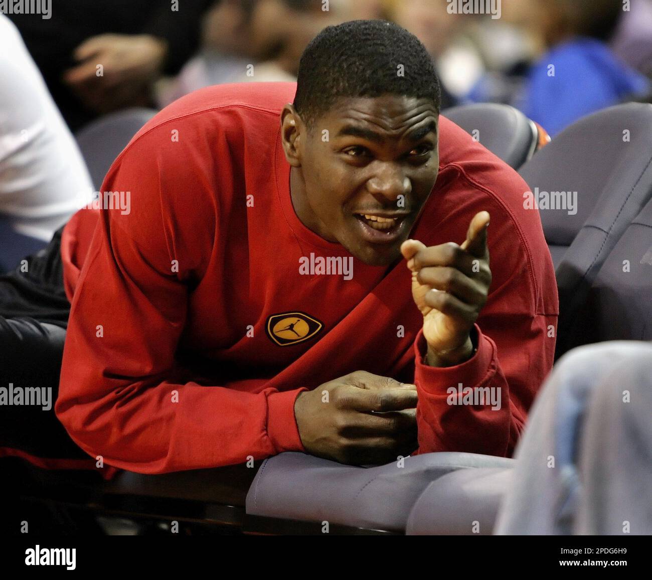 Dallas Cowboys wide receiver Keyshawn Johnson jokes with a fan as he sits  courtside during the Charlotte Bobcats' NBA basketball game against the Los  Angeles Clippers in Charlotte, N.C., Friday, Dec. 23,
