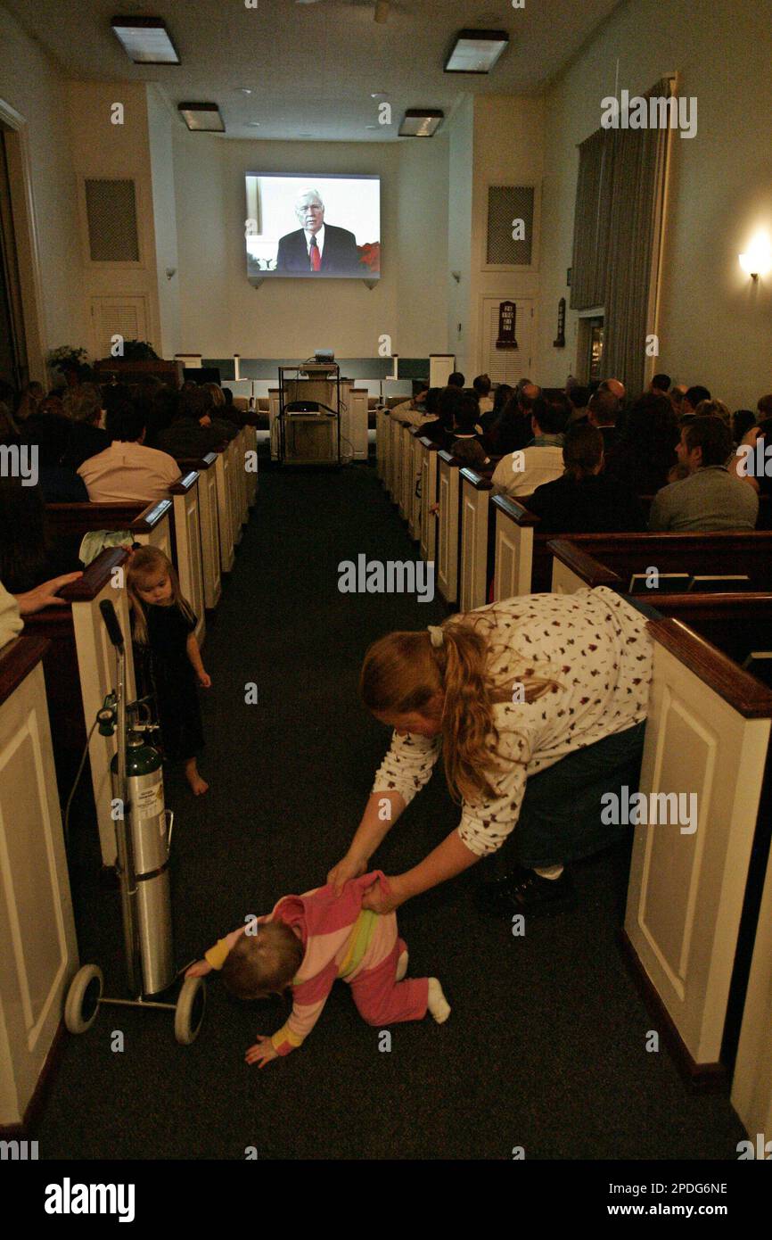 Katherine b of Kittery, Maine, scoops up her daughter Breanna b