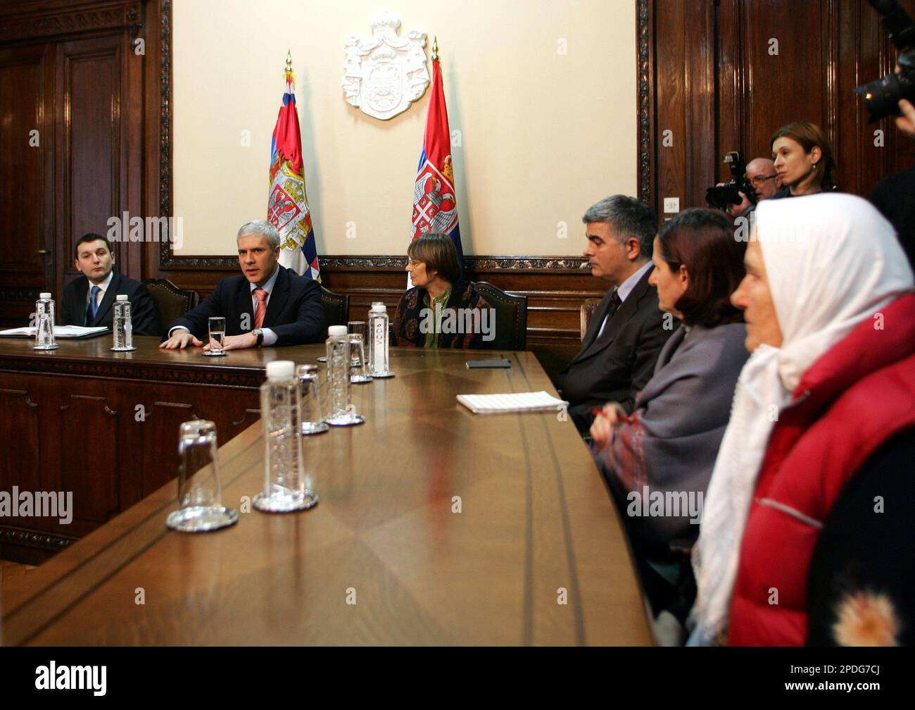 Serbian President Boris Tadic, second from left, speaks with family members  of Bosnian Muslim men and boys whose execution has been captured on  videotape, in Belgrade, Serbia and Montenegro, Friday, Dec. 23,