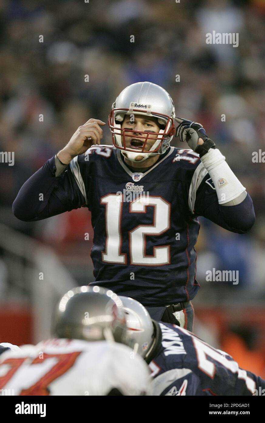 New England Patriots quarterback Tom Brady calls a play at the line of  scrimmage against the Tampa Bay Buccaneers during their football game  Sunday, Dec. 18, 2005, in Foxborough, Mass. Brady leads