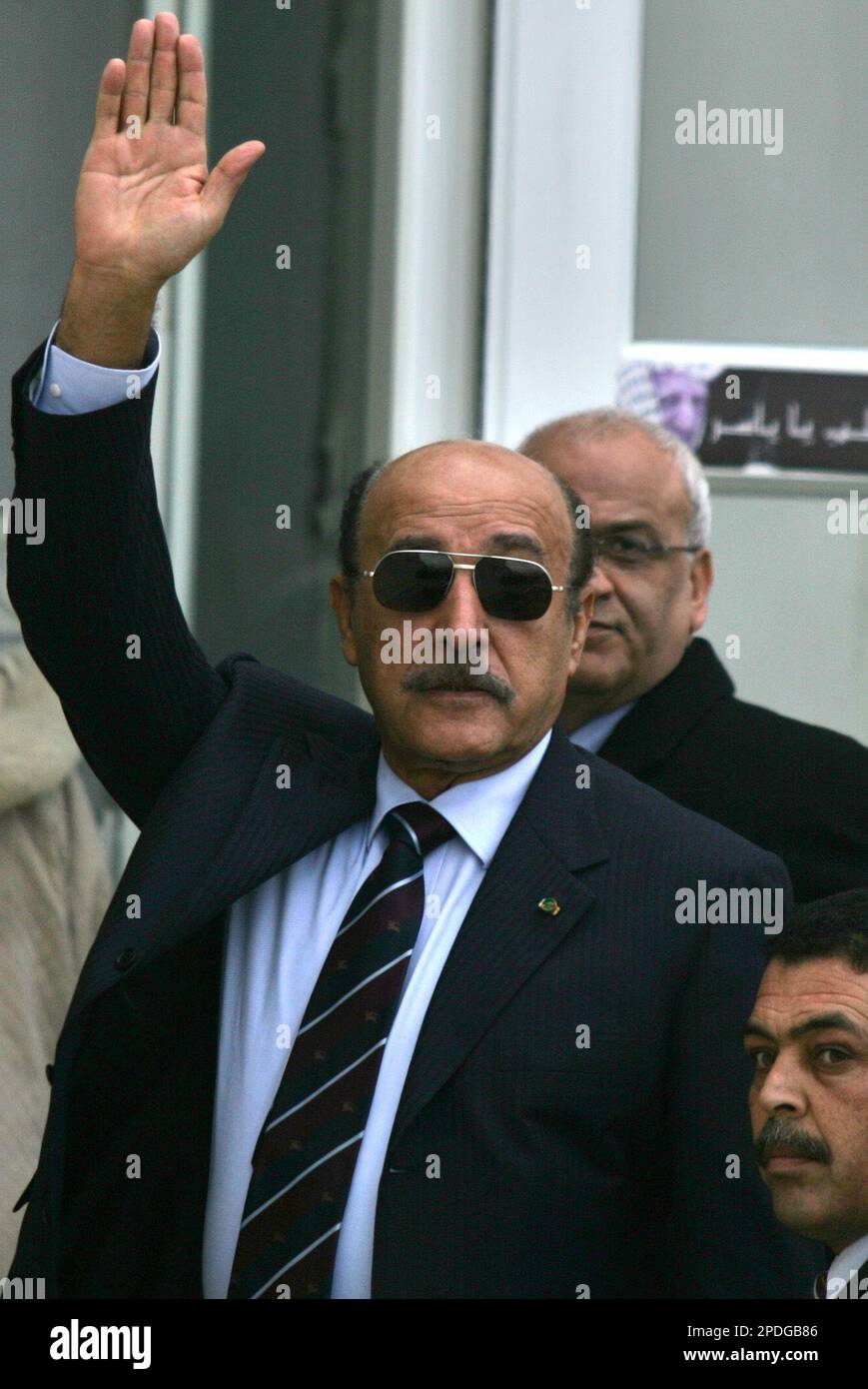 Egyptian intelligence chief Omar Suleiman waves as he arrives at the