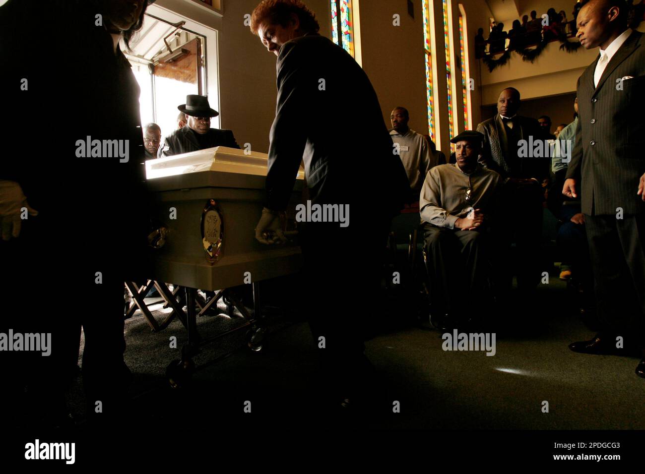 The Casket Containing The Body Of Stanley Tookie Williams Is Wheeled the-casket-containing-the-body-of-stanley-tookie-williams-is-wheeled
