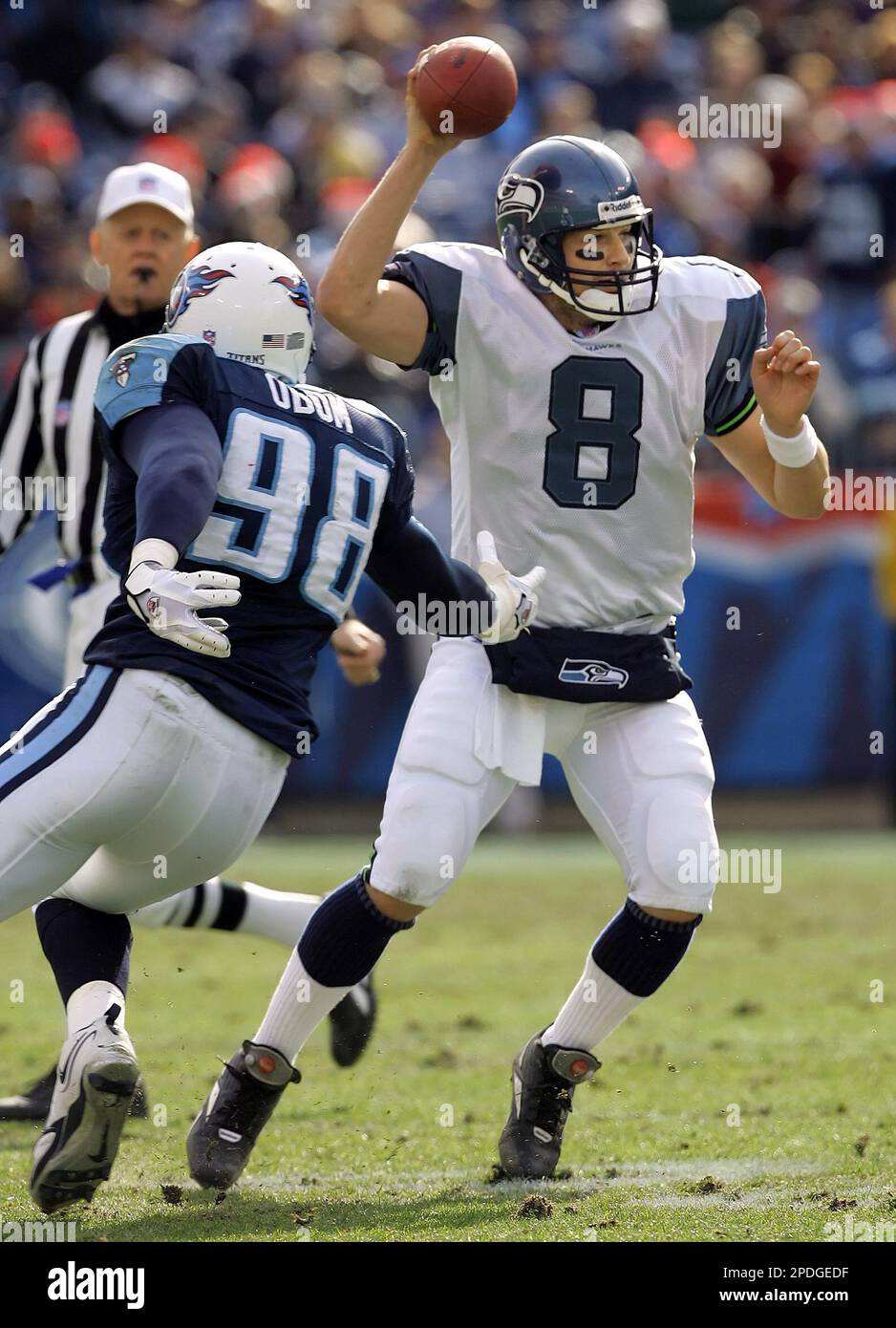 Seattle Seahawks quarterback Matt Hasselbeck (8) scrambles away from  Tennessee Titans defensive end Antwan Odom (98) during the first quarter of  an NFL football game Sunday, Dec. 18, 2005, in Nashville, Tenn.