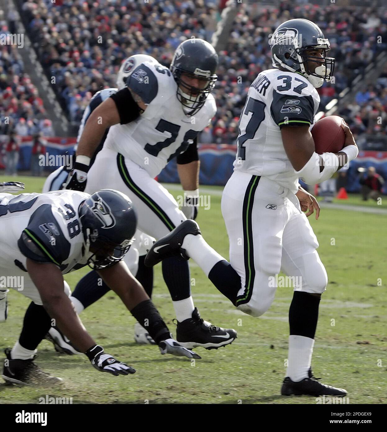 Seattle Seahawks running back Shawn Alexander (37) scores a touchdown on a  1-yard run against the Tennessee Titans during the first quarter of an NFL  football game Sunday, Dec. 18, 2005, in