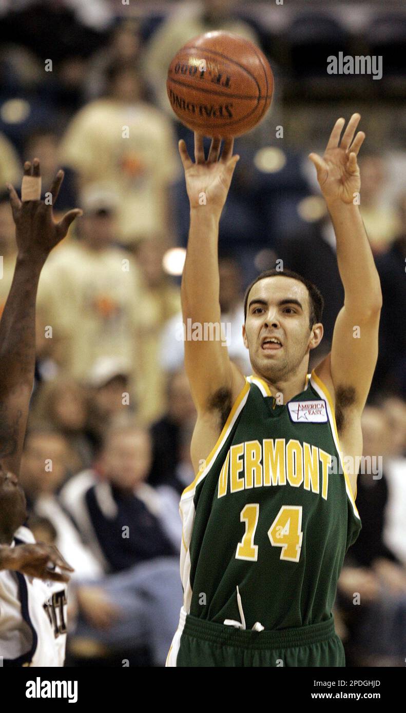 Vermont's Kyle Cieplicki (14) shoots a 3-pointer over Pittsburgh's Carl  Krauser, left, during the second half Pittsburgh's 63-52 win in an NCAA  men's college basketball game in Pittsburgh, Saturday, Dec. 17, 2005. (