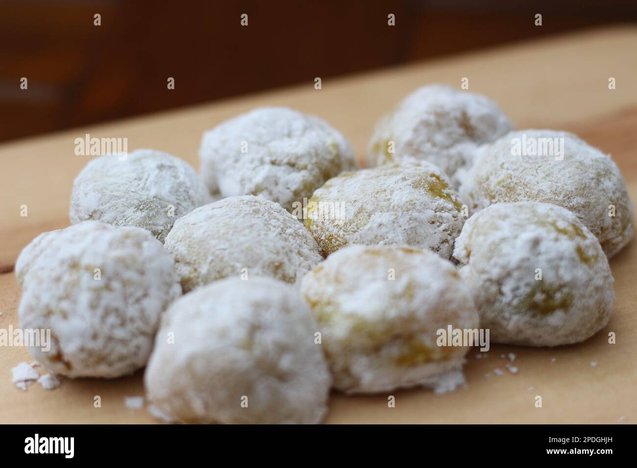 a close up of durian-flavored mochi served on a cutting board and ready to be eaten. Stock Photo