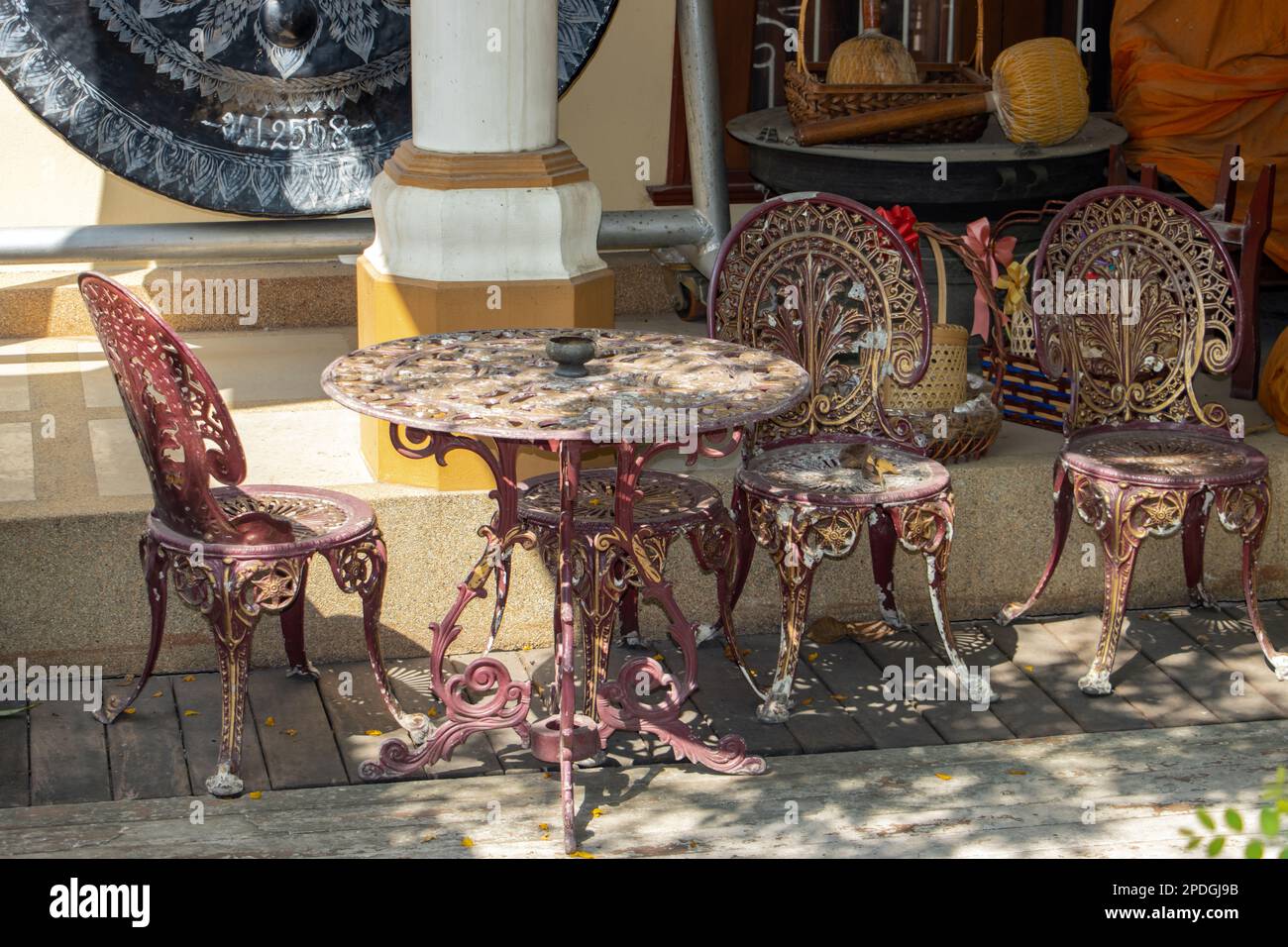 Decorative chairs with a table in the courtyard of the Buddhist temple