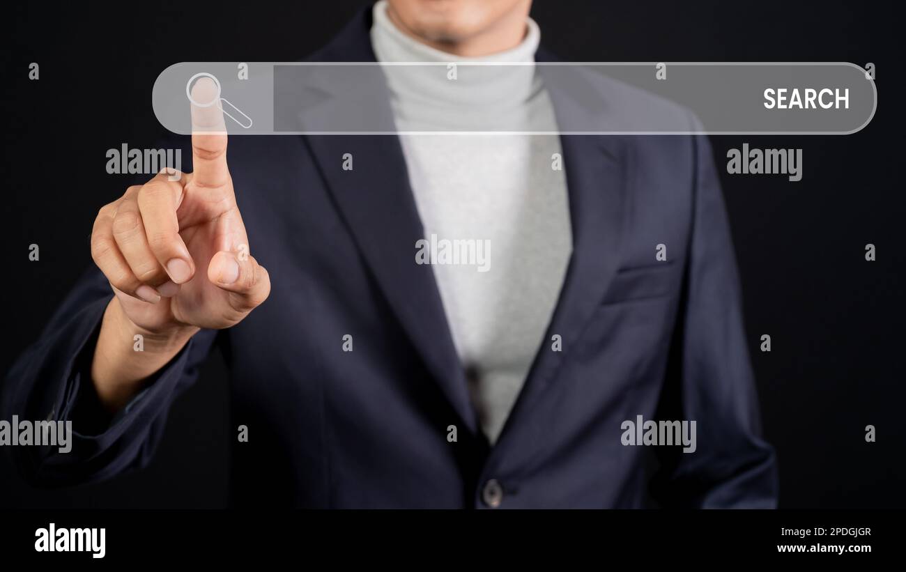Male hand touching search bar for search engine optimization. Looking for information or data through an internet connection. Stock Photo