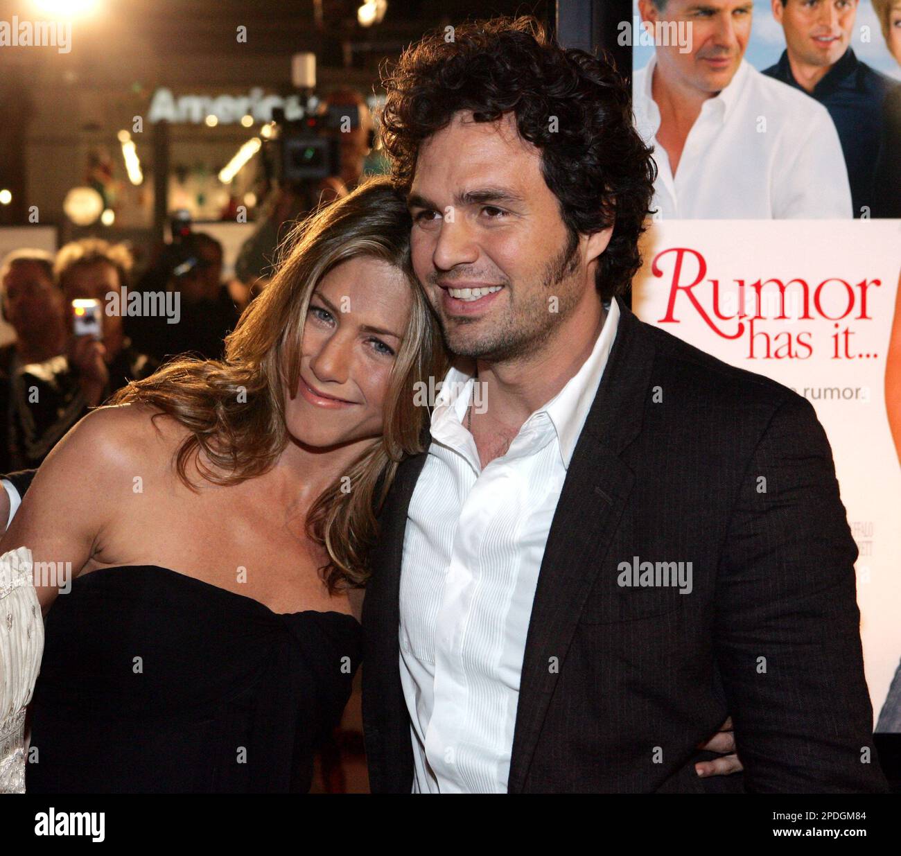 Actress Jennifer Aniston, left, leans on fellow cast member Mark