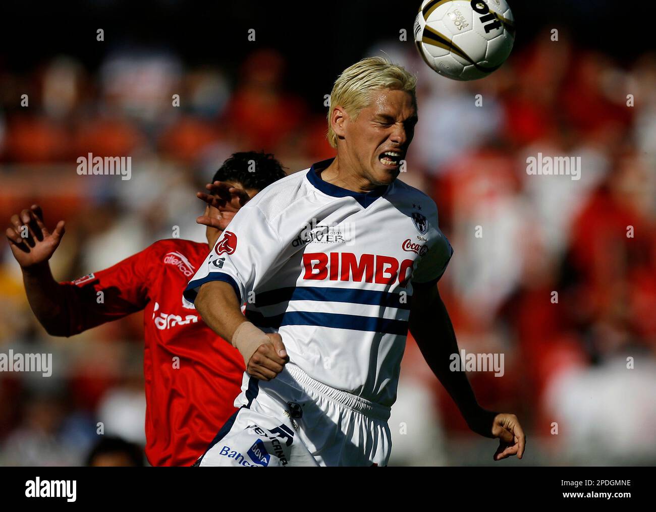 Monterrey's soccer player Guillermo Franco, front, from Argentina head the  ball as Toluca' Carlos Esquivel challenges during the first leg of the  Mexican league championship soccer final at the Nemecio Diez stadium