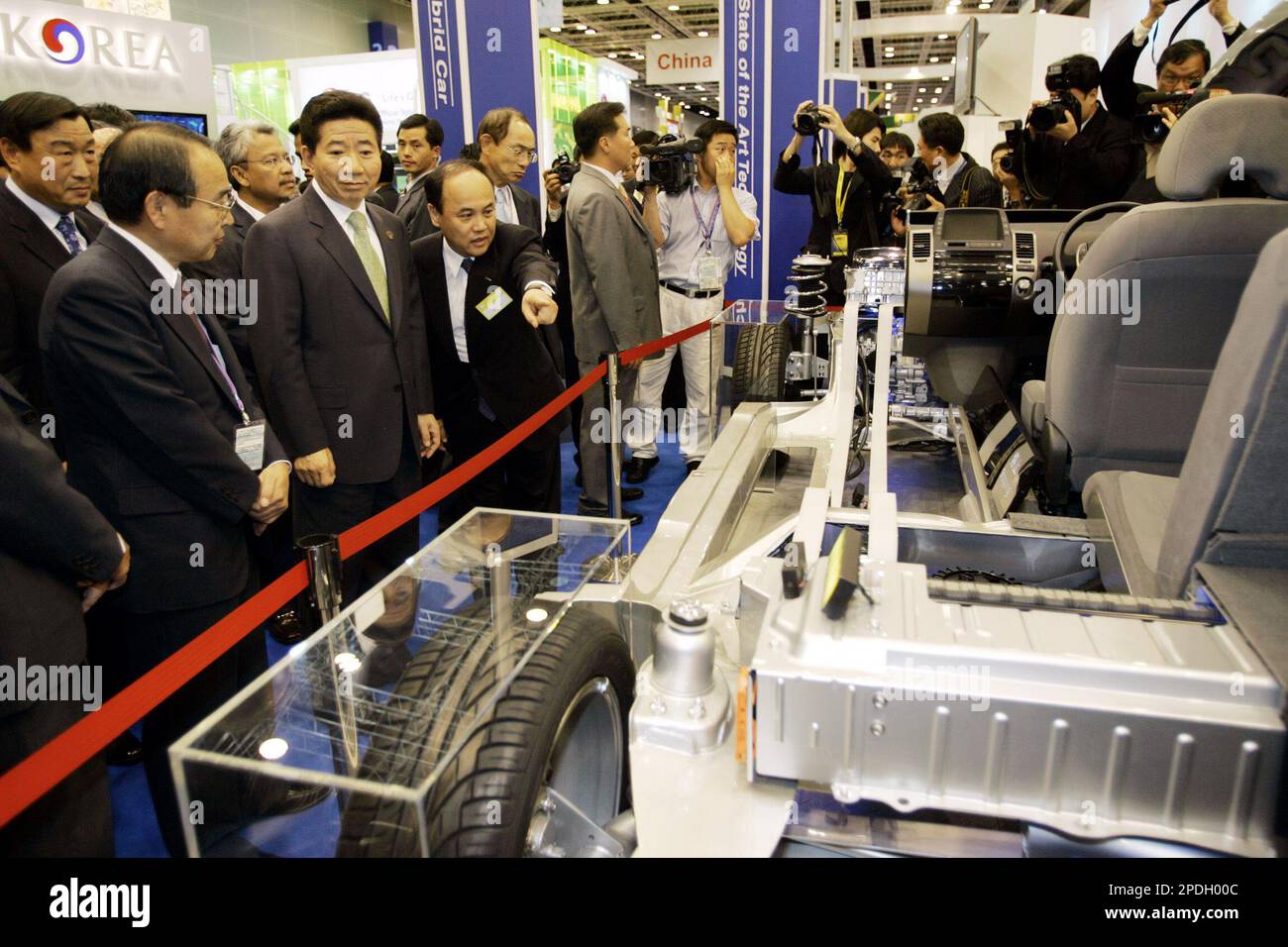 South Korea's President Roh Moo-Hyun, second from left, looks at one of ...