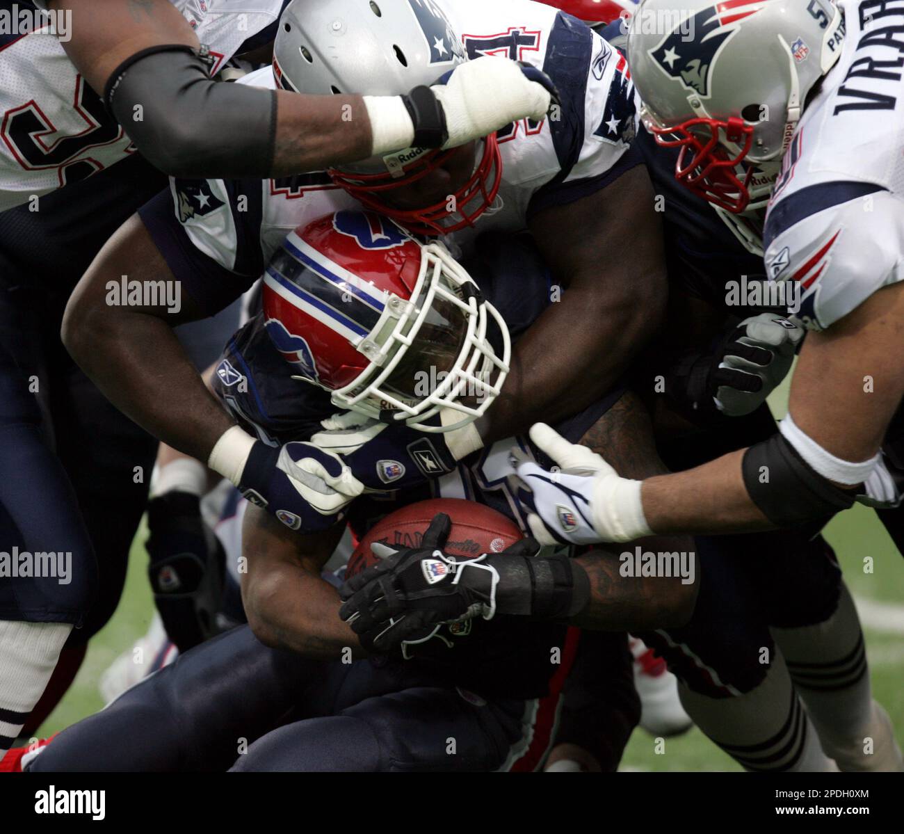 Buffalo Bills' Willis McGahee (21) is tackled by New England