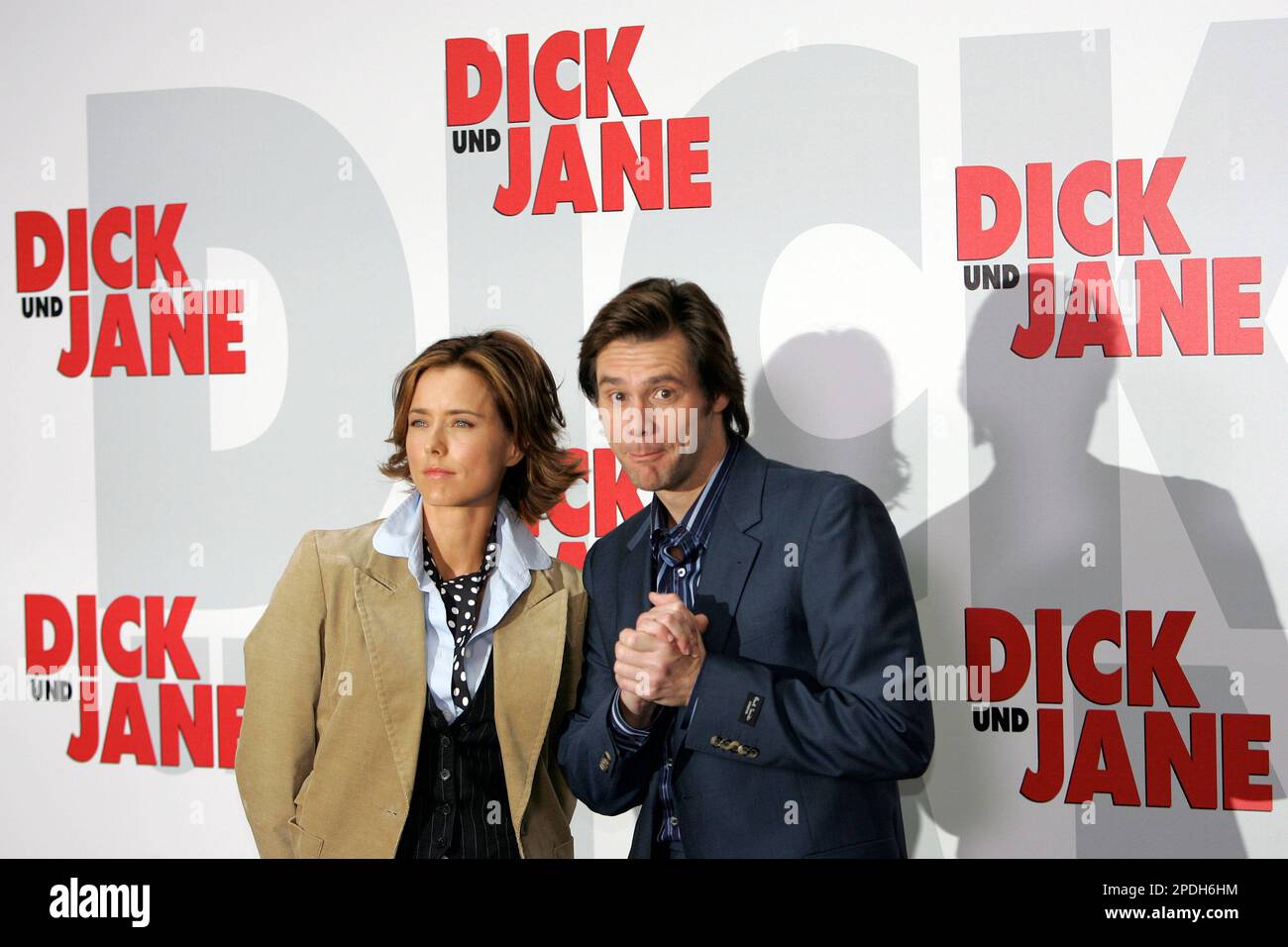 Actors Tea Leoni, left, and Jim Carrey pose for photographers at a