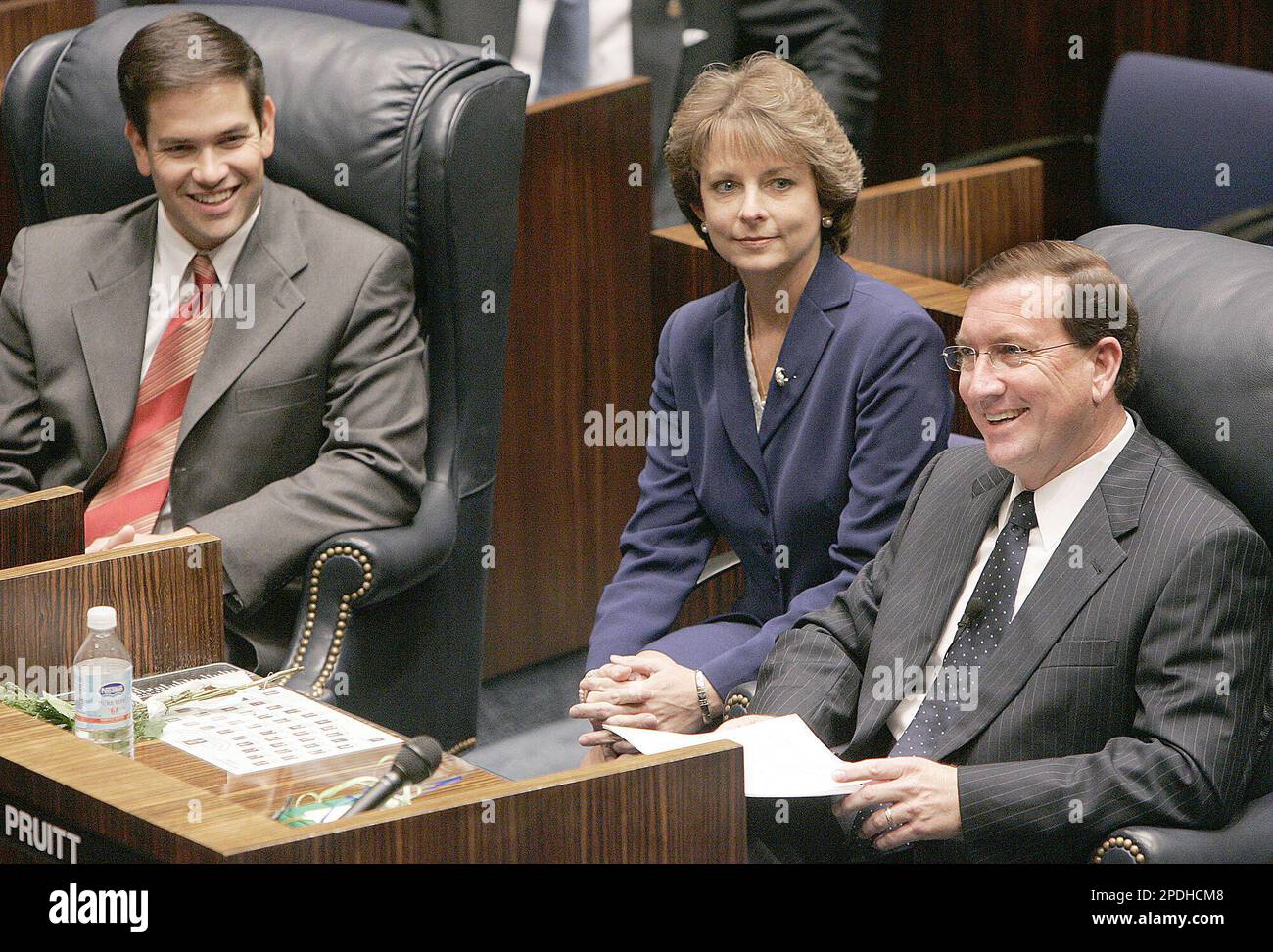 Sen. Ken Pruitt, R-Port St. Lucie, right, sits at his desk along side ...