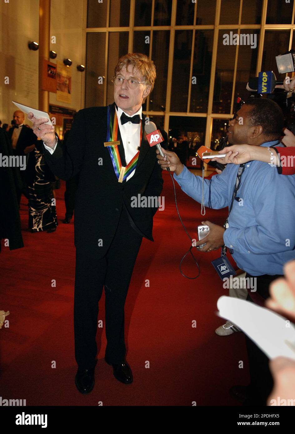 Kennedy Center honoree Robert Redford talks to the press on the red