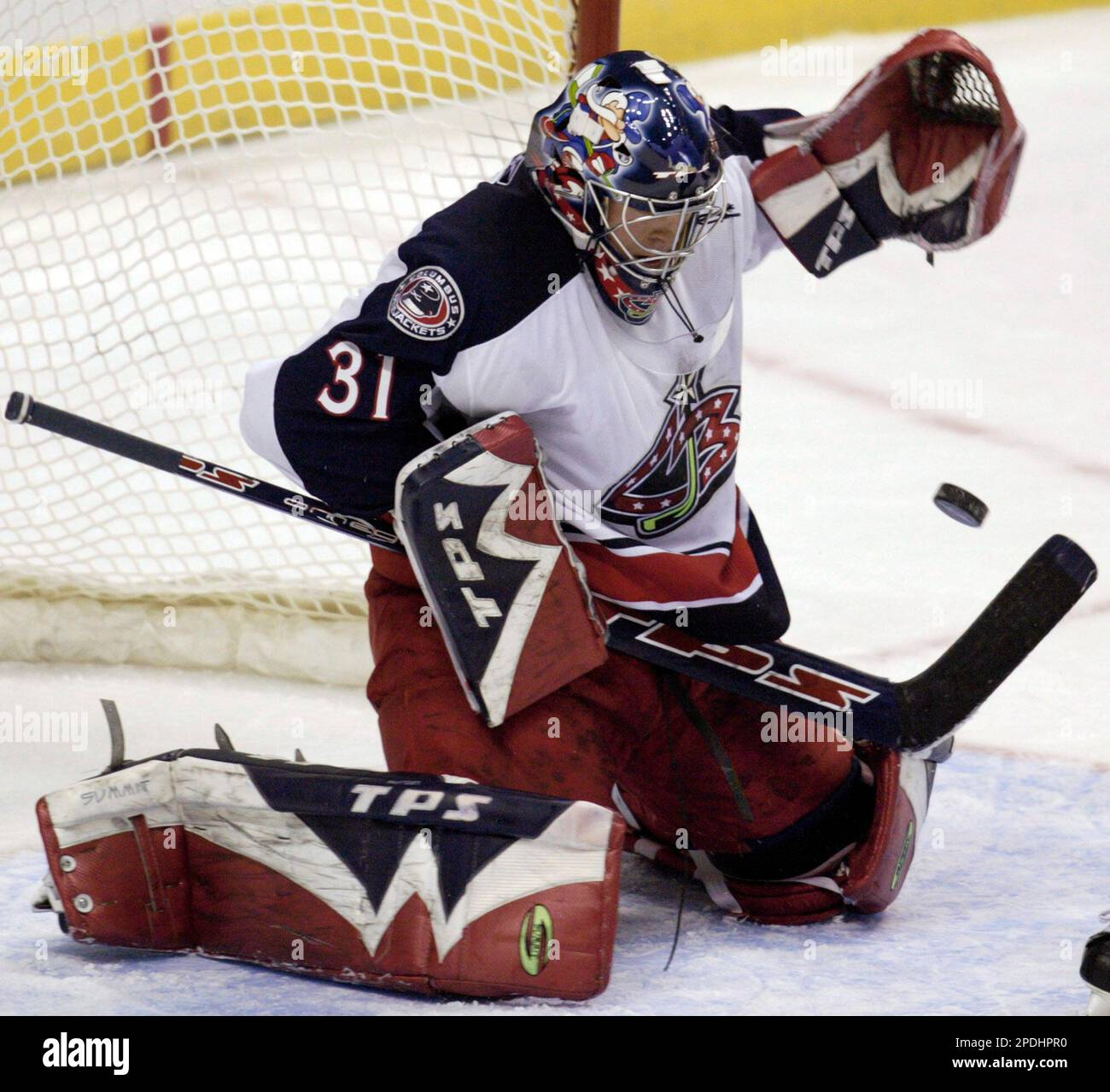 Columbus Blue Jackets goaltender Pascal Leclaire makes a save during first-period  NHL hockey against the New Jersey Devils, Saturday night, Oct. 28, 2006, in  East Rutherford, N.J. (AP Photo/Bill Kostroun Stock Photo 