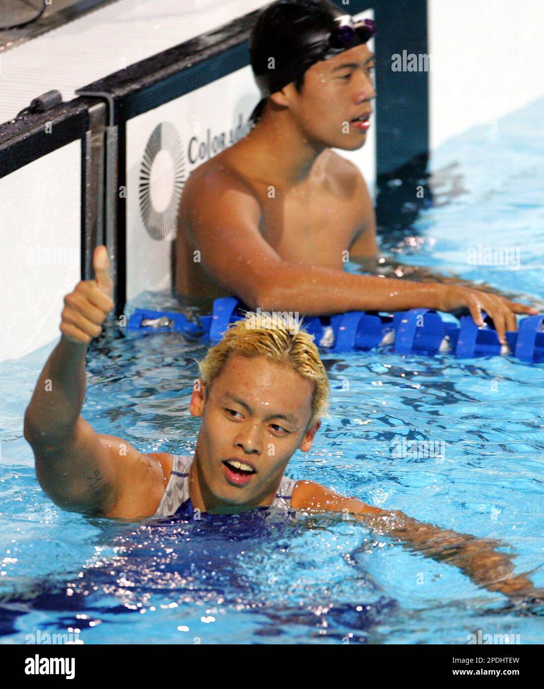 https://c8.alamy.com/comp/2PDHTEW/singapores-lionel-lee-flashes-the-thumbs-up-sign-following-his-gold-medal-finish-in-the-mens-400m-freestyle-finals-of-the-23rd-sea-games-thursday-dec-1-2005-at-trace-college-at-los-banos-south-of-manila-philippines-lee-clocked-40051-seconds-to-win-gold-ap-photobullit-marquez-2PDHTEW.jpg