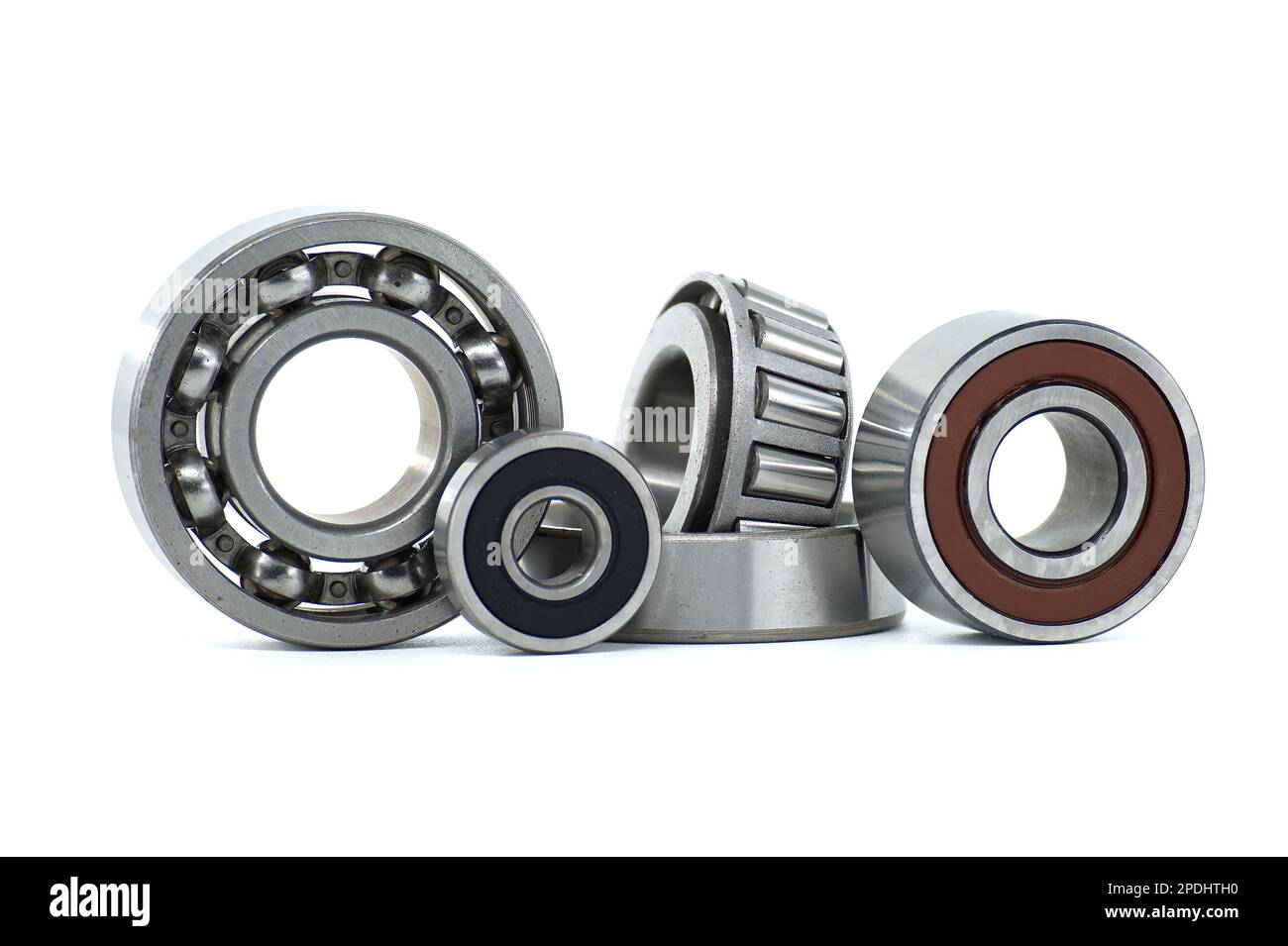 Various ball bearings and tapered roller bearing isolated on white