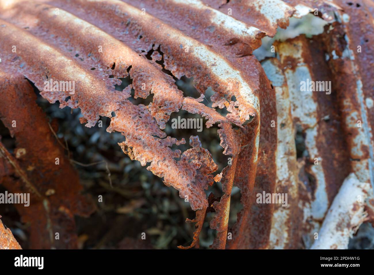 Close up view of a rusted and decayed old corrugated iron watertank