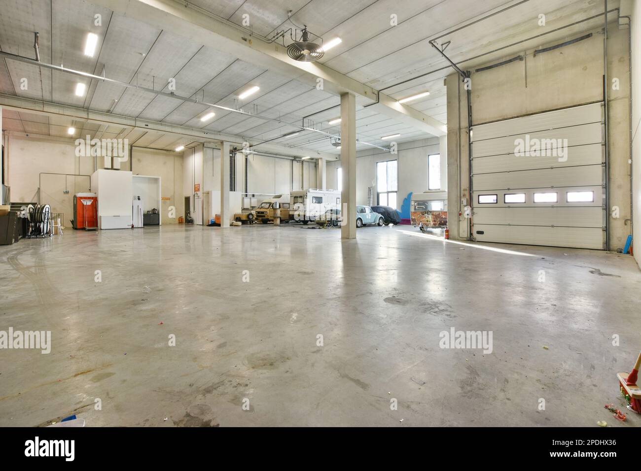 the inside of a building with lots of work on the floor and equipment ...