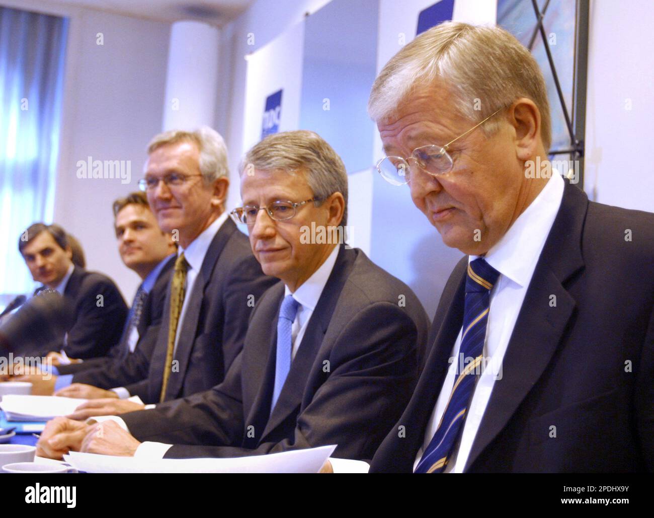 TDC Managing Director Henning Dyremose, right, prepares his notes at a press conference to announce the sale of the company to outside investors. A group of private equity firms launched a 76 billion kroner (euro10.2 billion; US$12 billion) offer for TDC A/S, Denmark's leading telecommunications operator. TDC provides local and long-distance services, Internet access and cell phone service in Denmark and elsewhere in Europe.(AP Photo/John McConnico) Stock Photo