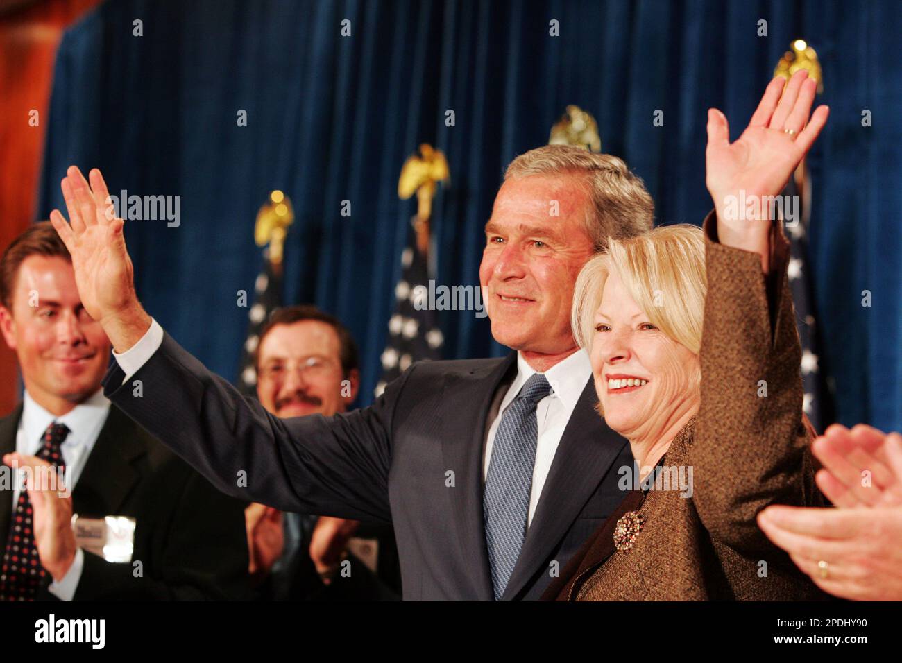 President Bush and Rep. Marilyn Musgrave, RColo., wave to the crowd at