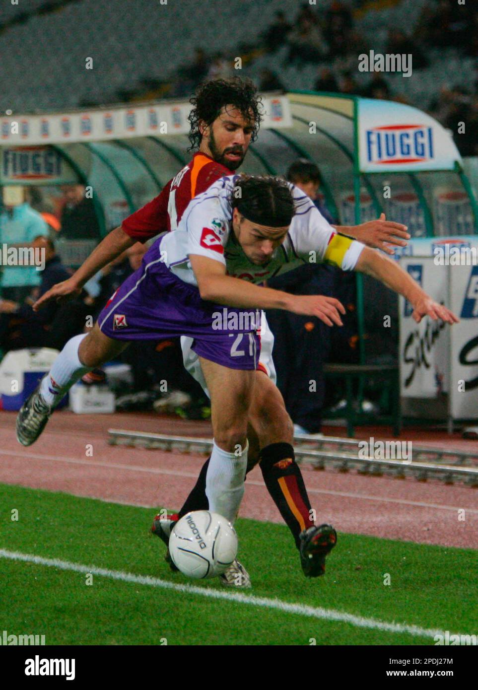 Roma's Damiano Tommasi, in background, pursues Fiorentina's Tomas Ujfalusi,  during the Italian Serie A major league soccer match between Roma and  Fiorentina at Rome's Olympic stadium, Sunday, Nov. 27, 2005. Tommasi  treasured
