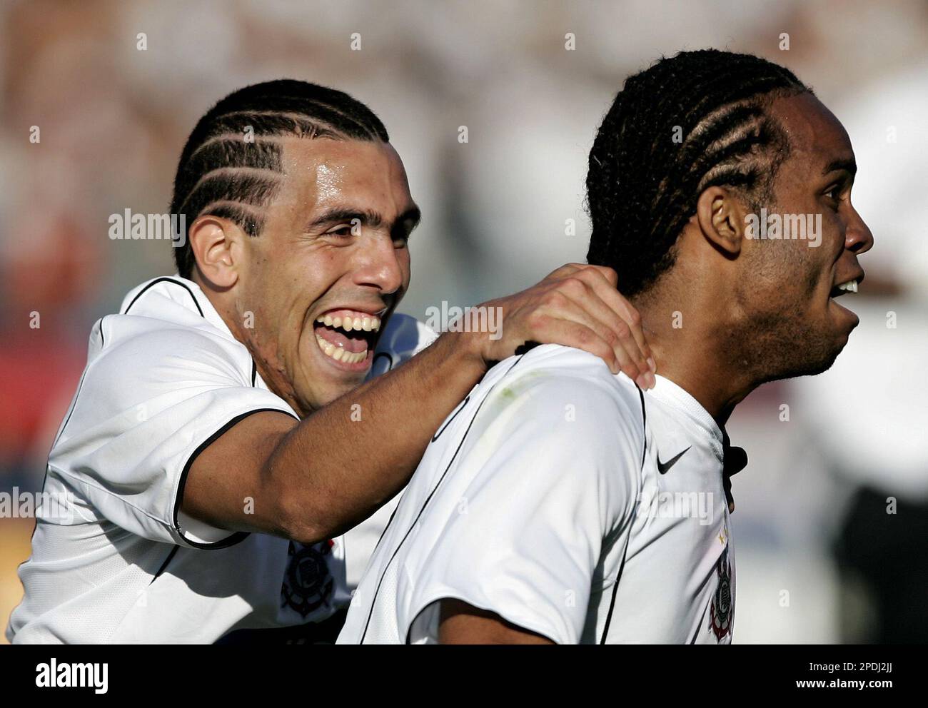Corinthians' Carlos Tevez, left, of Argentina, celebrates the goal