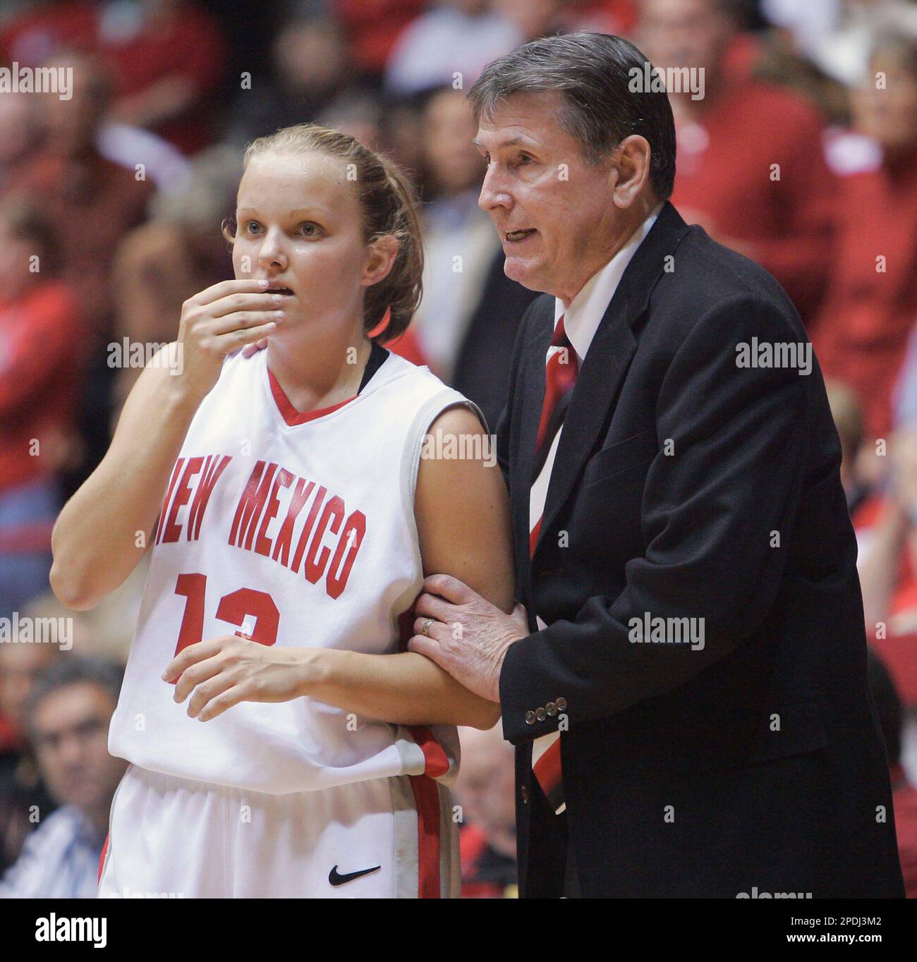 New Mexico coach Don Flanagan goes over some instructions with Katie Montgomery in the final seconds of the UNM Thanksgiving Tournament championship game at The Pit in Albuquerque, N.M., Saturday, Nov. 26, 2005. New Mexico defeated Oklahoma State 56-52. (AP Photo/Jake Schoellkopf) Stock Photo