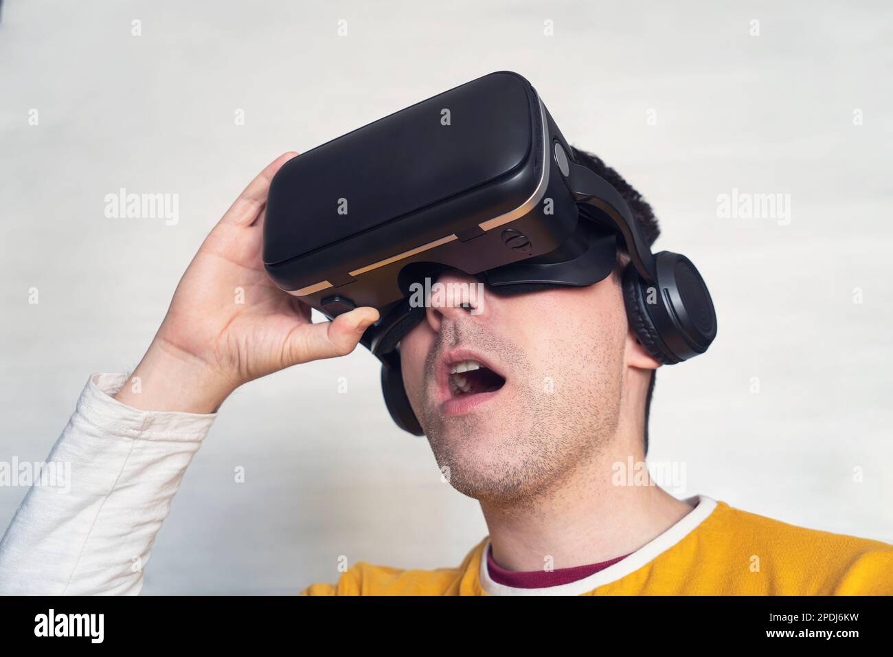 Man looking at vr box, Virtual Reality Glasses, cardbox. Waist up