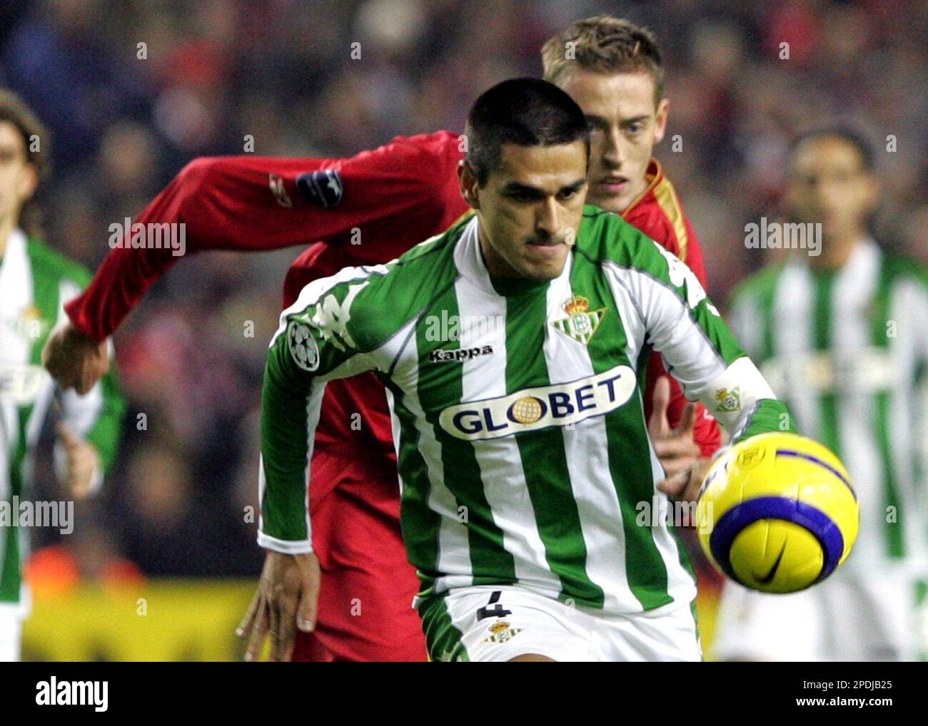 Liverpool's Peter Crouch, right,, closes in on Real Betis' Gutierrez Juanito,  front, during their Champions League, Group G, soccer match at Anfield,  Liverpool, England, Wednesday Nov. 23, 2005. (AP Photo/Fernando Bustamante  Stock