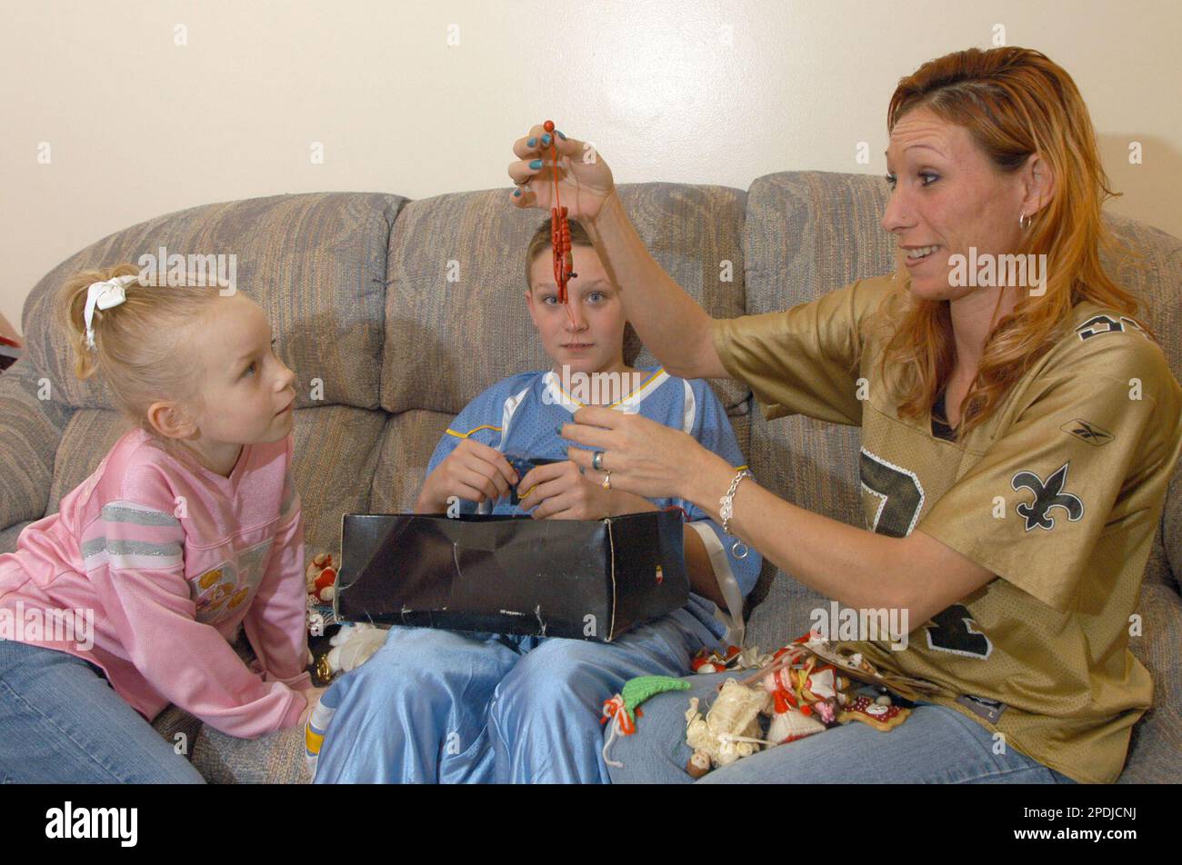 Marissa Bratcher, 6, left, Drew Bratcher, 11, and their mother Melissa