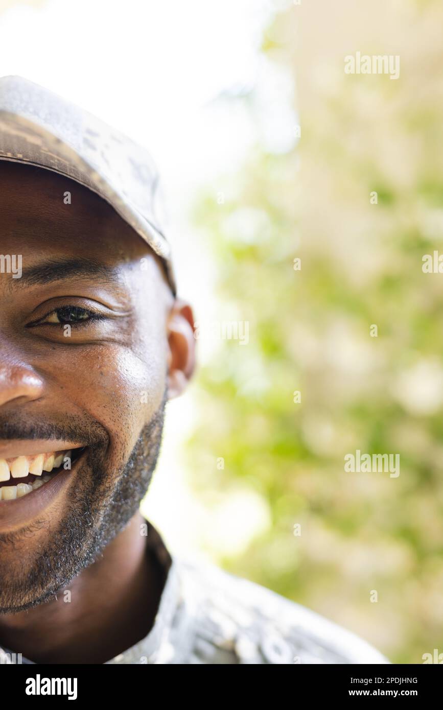 Portrait of happy african american male soldier looking at camera and smiling, with copy space Stock Photo
