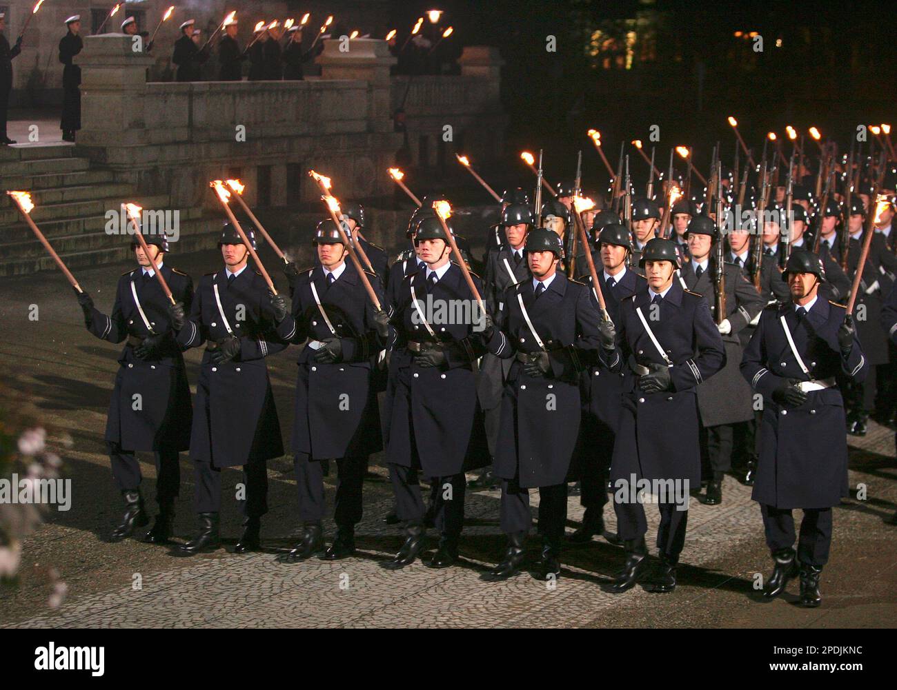 Members of a German honour guard arrive for an army torchlight parade ...
