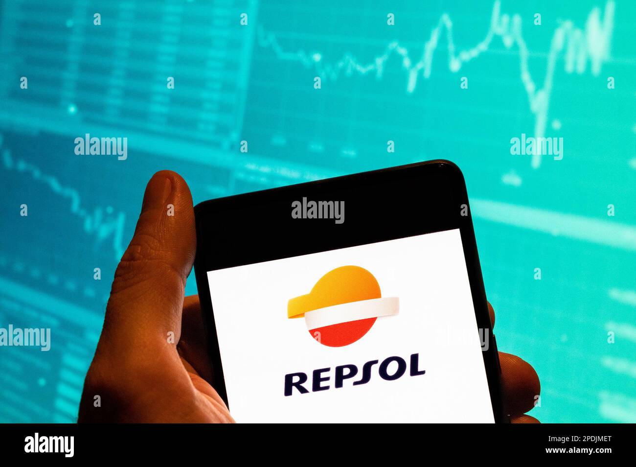 China. 15th Feb, 2023. In this photo illustration, the Spanish fossil fuel  energy and petrochemical company, the Repsol logo is seen displayed on a  smartphone with an economic stock exchange index graph