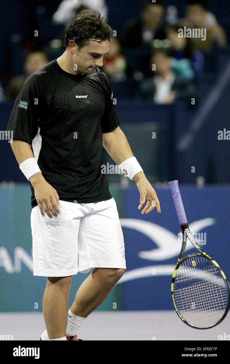 Mariano Puerta of Argentina throws his racket after losing a point during a  second singles match against Fernando Gonzalez of Chile for the Shanghai  Tennis Masters Cup Wednesday, Nov. 16, 2005 at