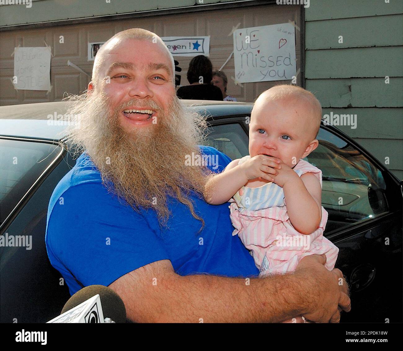 Steven Avery holds his great niece, 8-month-old, Danielle Avery, who he has never met, as the media interviews him on his arrival home to rural Two Rivers, Wis., after his release from prison Sept. 11, 2003. Avery, a man who spent 18 years in prison for a rape he did not commit, intends to seek millions of dollars in damages in a lawsuit that contends his civil and constitutional rights were violated, his attorney said Thursday, Dec. 18, 2003. The development came hours after Attorney General Peg Lautenschlager concluded that no criminal charges or ethics violations should be brought against a Stock Photo