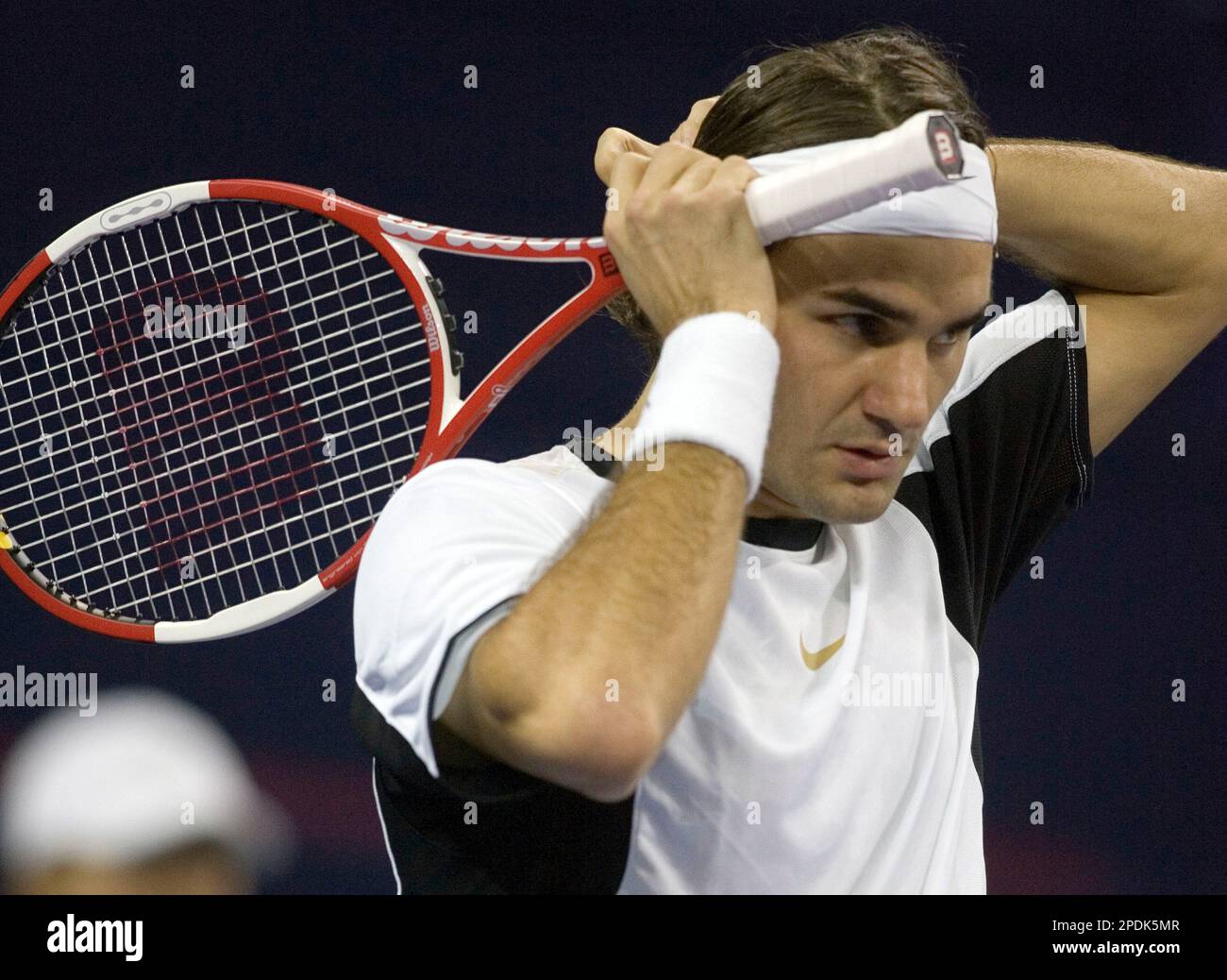 World's number one player, Switzerland's Roger Federer prepares to serve a  ball against Argentina's David Nalbandian (unseen) during the opening match  for the Shanghai Tennis Masters Cup held at the Qi Zhong