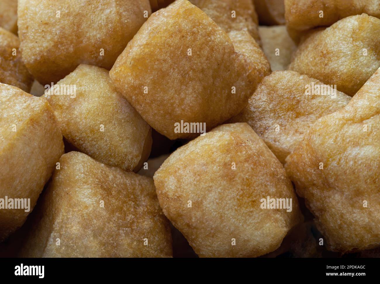 Close up of Brown fried tofu puffs or Deep Fried Tofu. Healthy asian