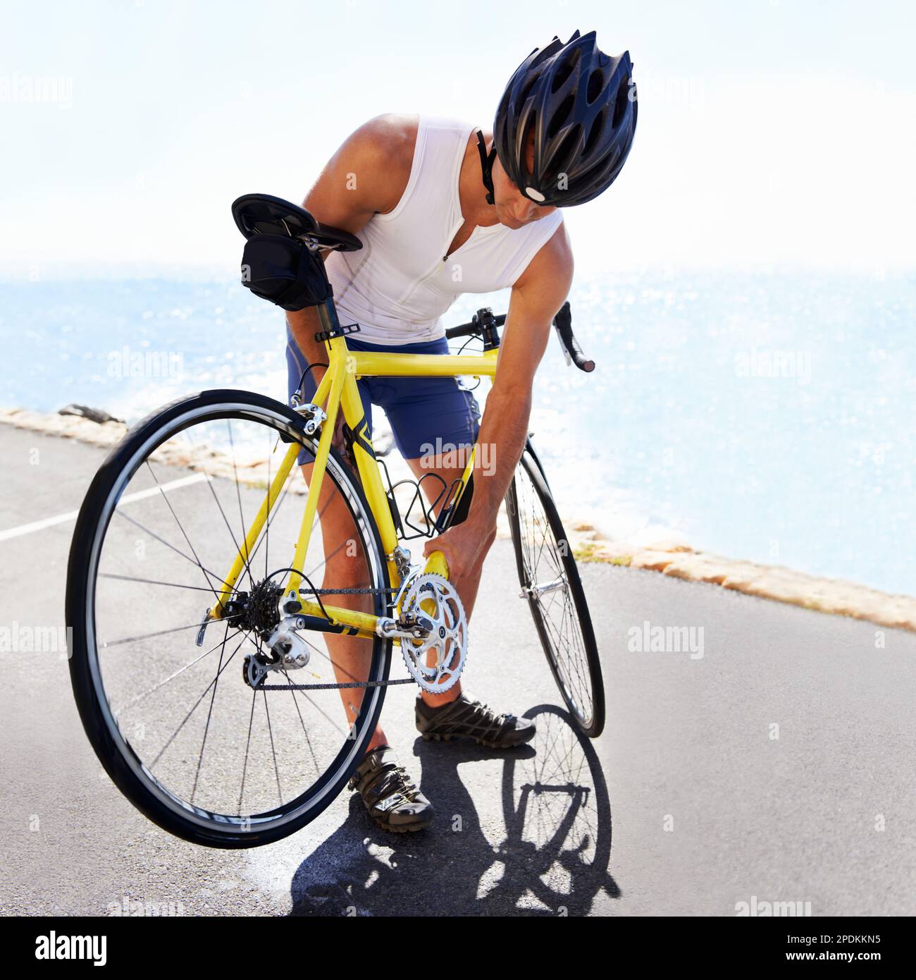 Replacing his bike chain. A young cyclist replacing his bike chain ...