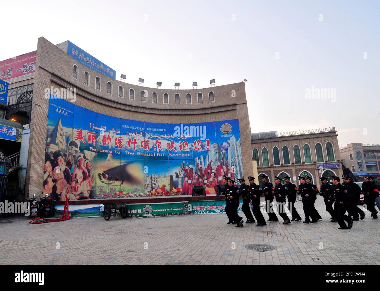 Early morning exercise for a local security force the city center of  Kashgar, Xinjiang, China. Stock Photo