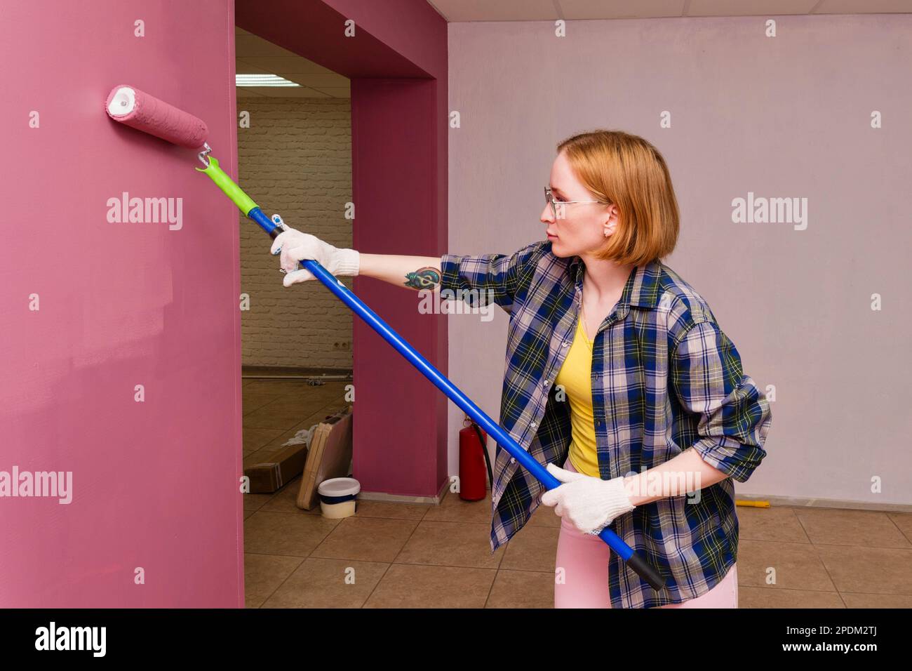 Photo inspiration: Fresh Look at Repair And Redecoration Concept Woman Professionally Paint Interior