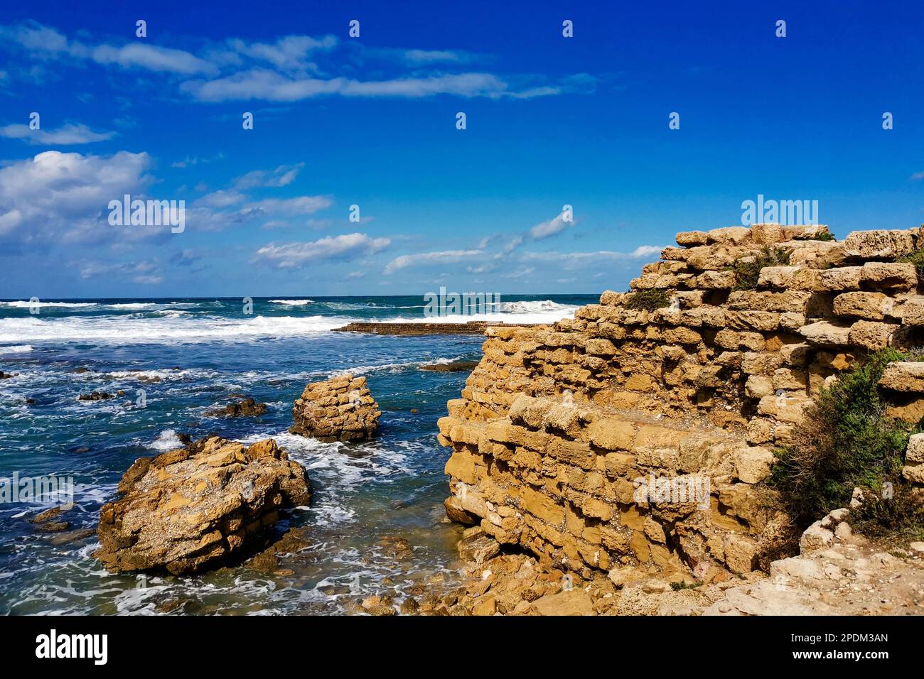 Ruins ancient city on Mediterranean coast. Colorful seascape in sunny weather at coast Stock Photo