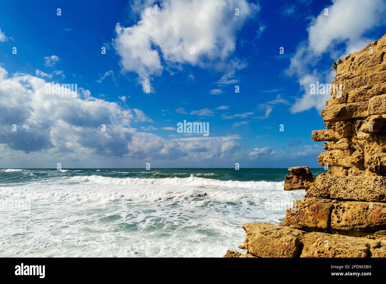 Ruins ancient city on Mediterranean coast. Colorful seascape in sunny weather at coast Stock Photo
