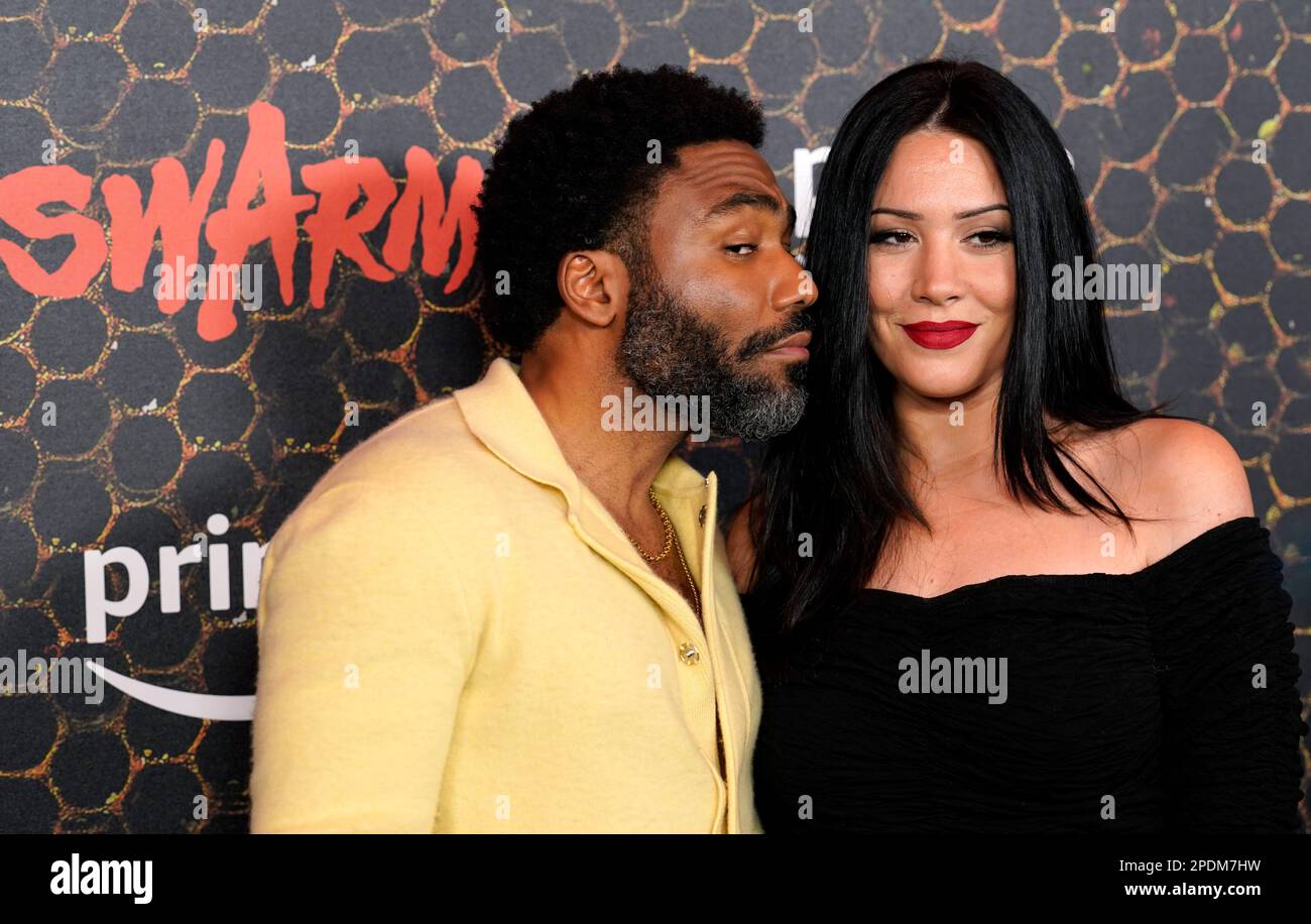 Donald Glover and Michelle White pose together at the premiere of the